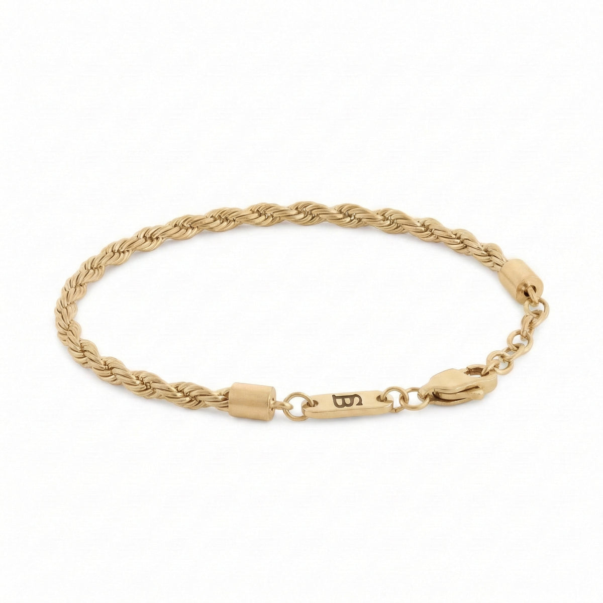 Gold braided stainless steel men's bracelet with plated 18K gold clasp and engraved tag detail displayed on a white background