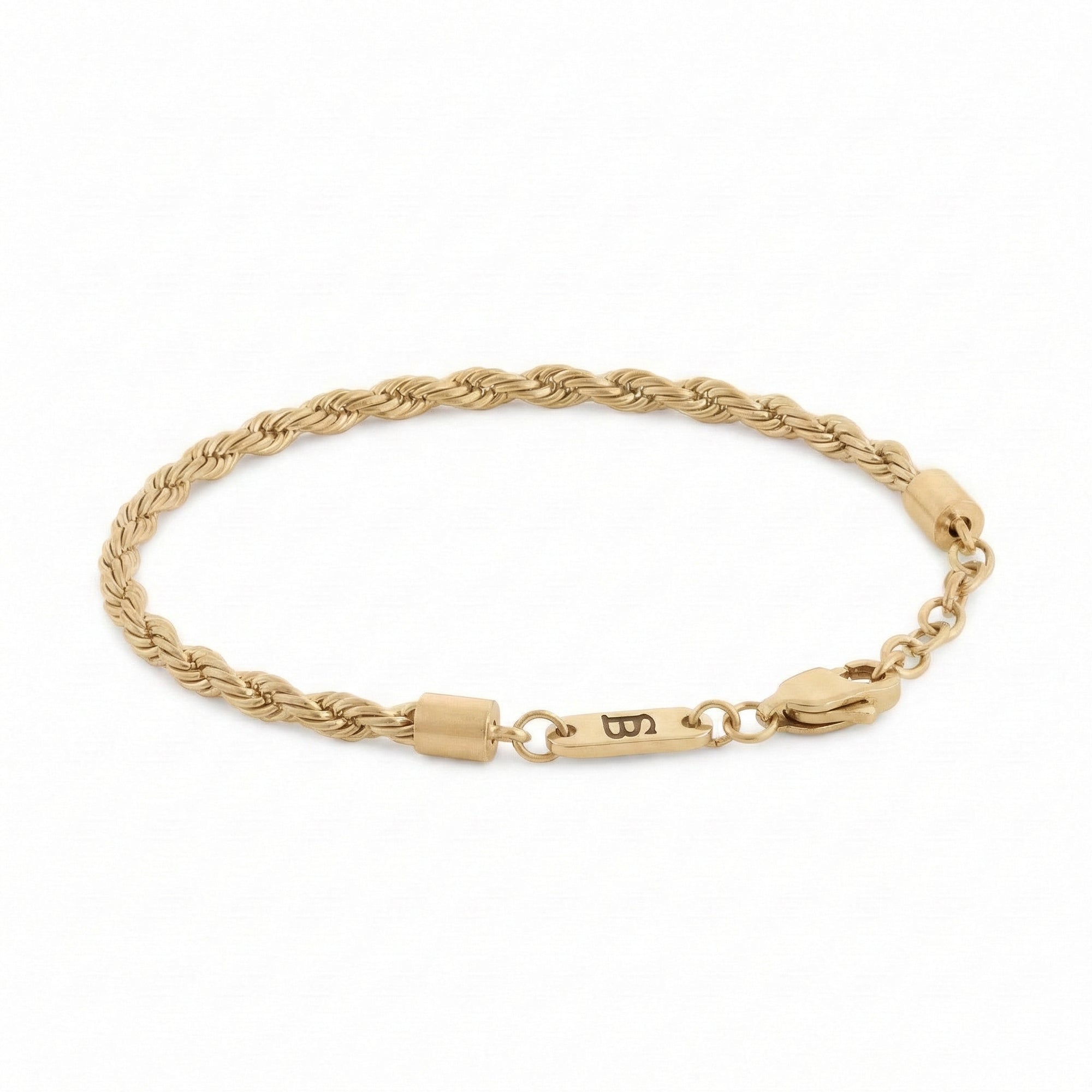 Gold braided stainless steel men's bracelet with plated 18K gold clasp and engraved tag detail displayed on a white background