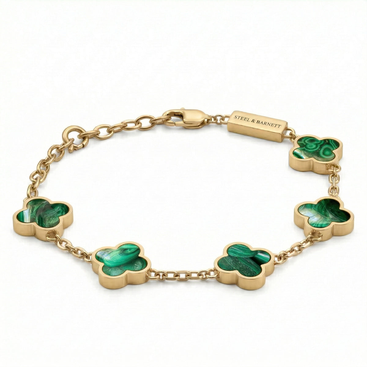 Gold toned men’s bracelet with green clover shaped stone inlays in a chain design and plated 18K gold clasp on a white background