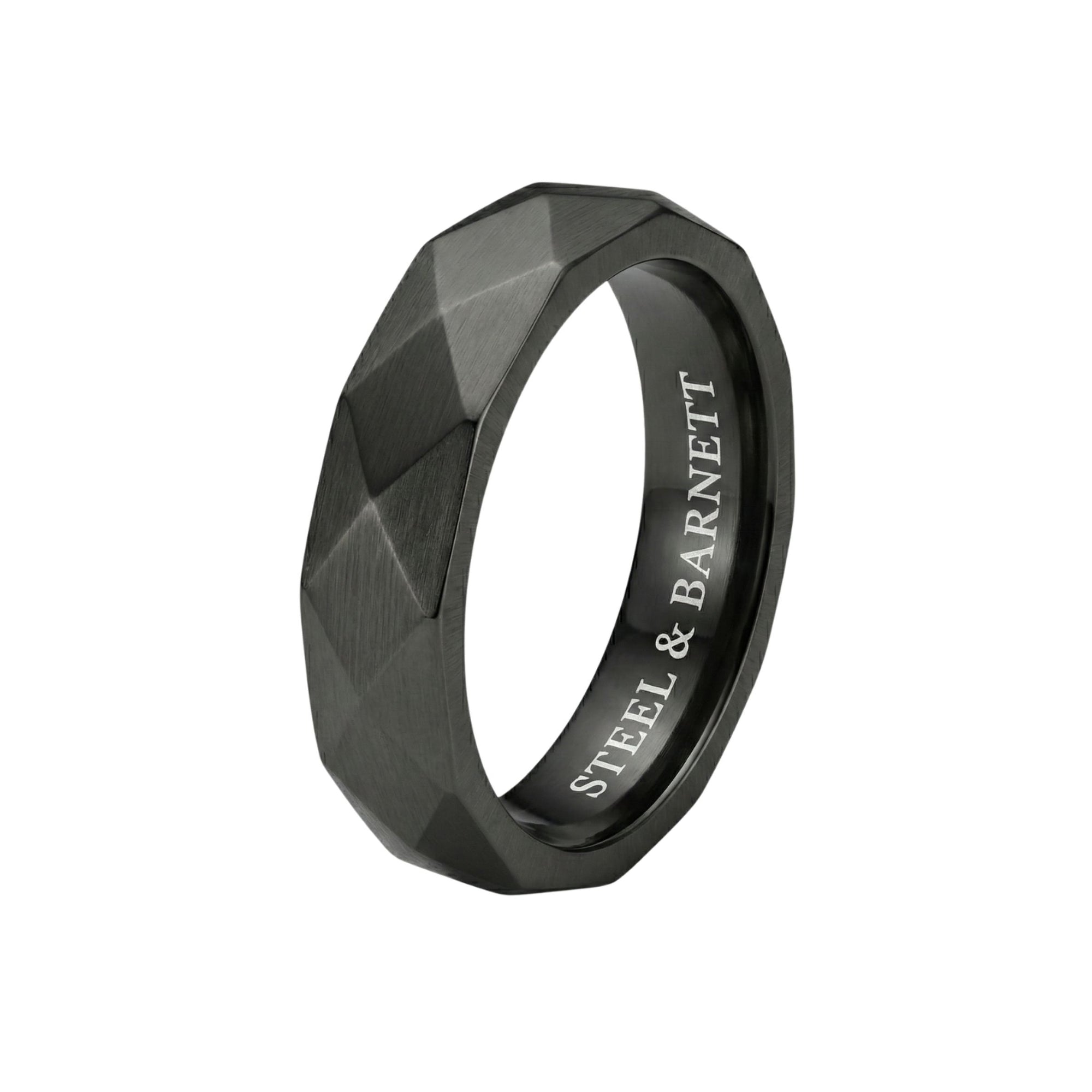Black stainless steel men's ring with a brushed faceted geometric design isolated on a white background