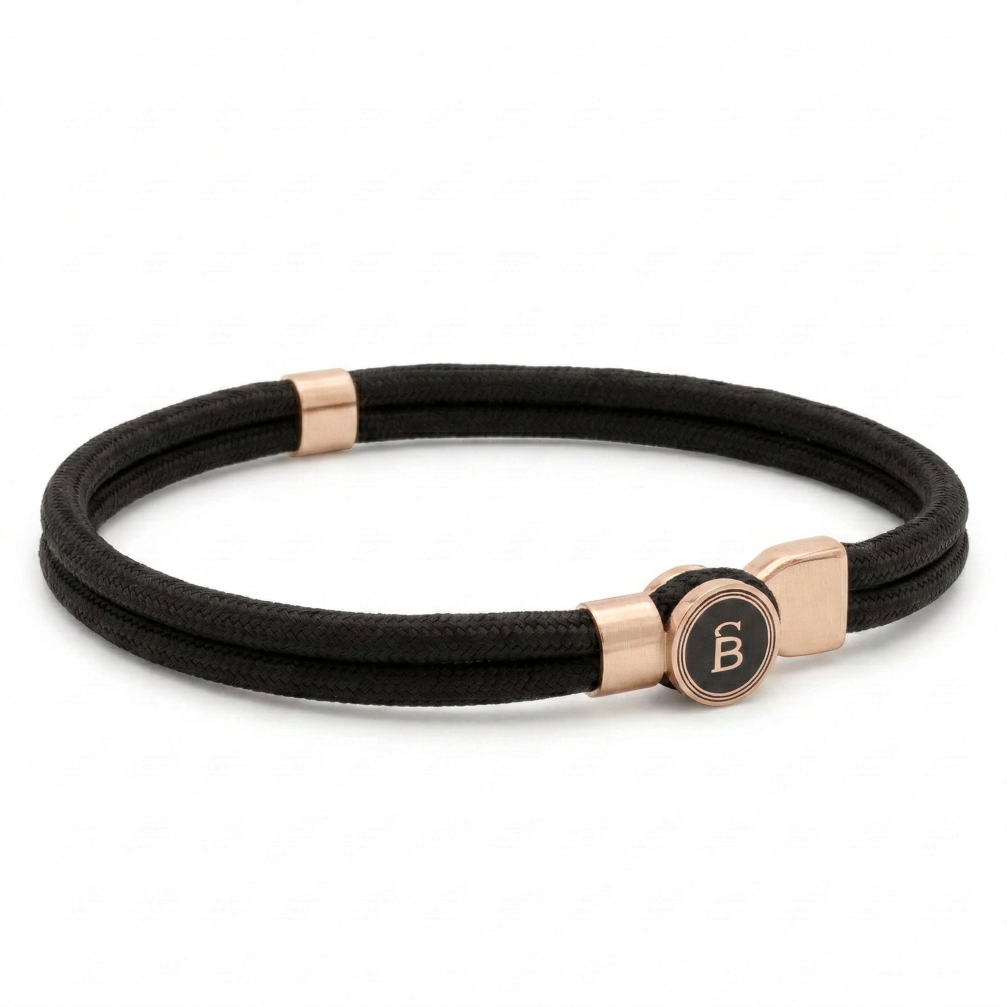 Black rope men’s bracelet with plated 18K gold clasp and round logo detail on a white background