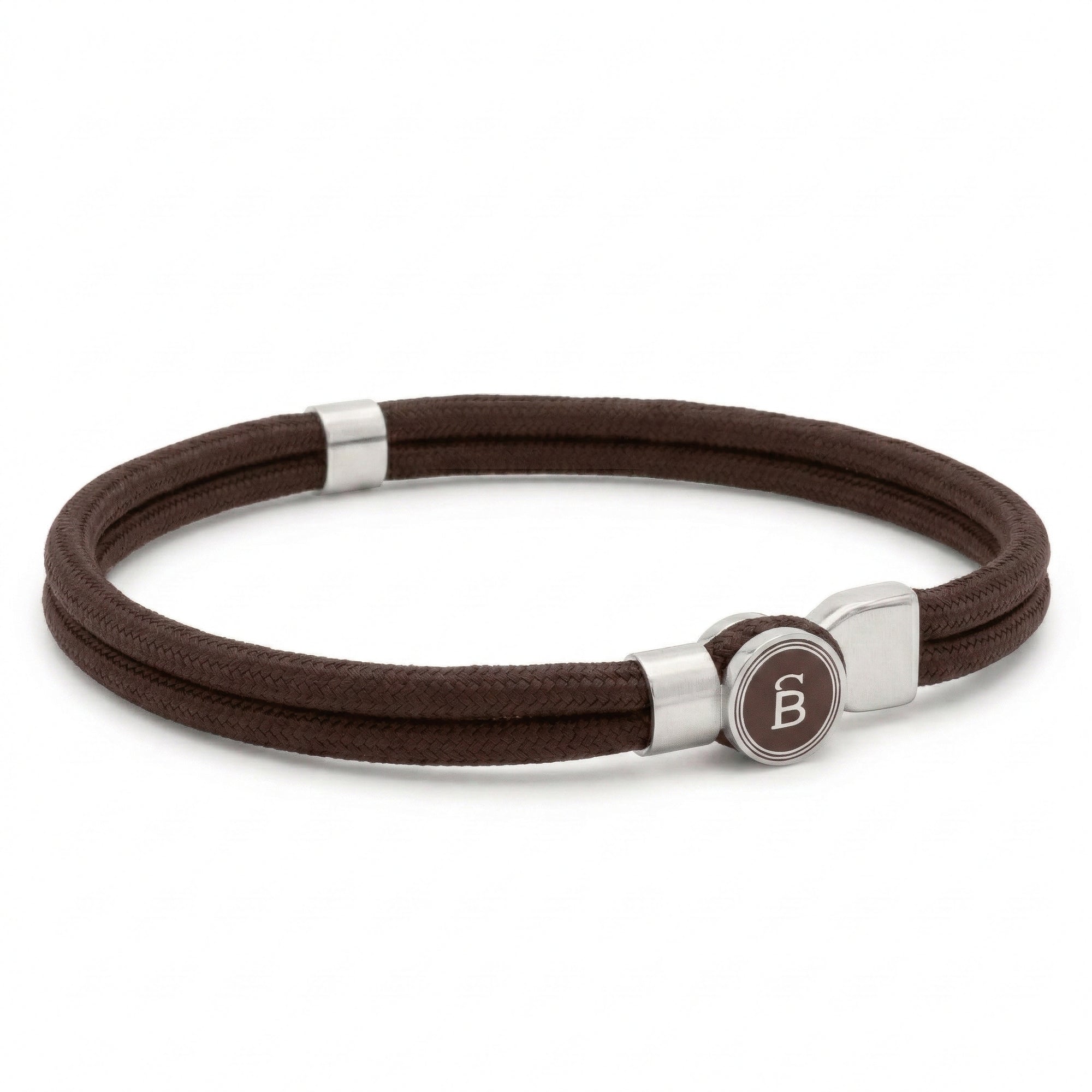 Brown rope men’s bracelet with brushed stainless steel magnetic clasp and round logo detail on a white background