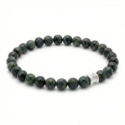 Green kambaba gemstone men’s bracelet with polished round beads and stainless steel accent bead on a white background