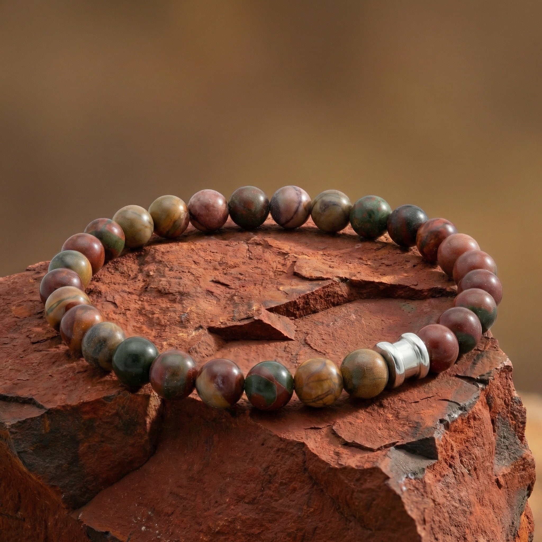 Cherry creek jasper men’s bracelet with round gemstone beads and stainless steel accent in a close up detail view