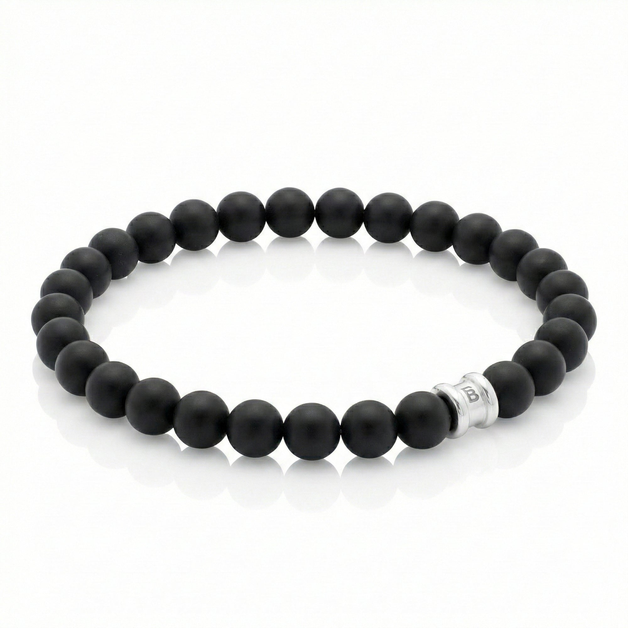 Black onyx men’s bracelet with matte round gemstone beads and stainless steel accent bead on a white background