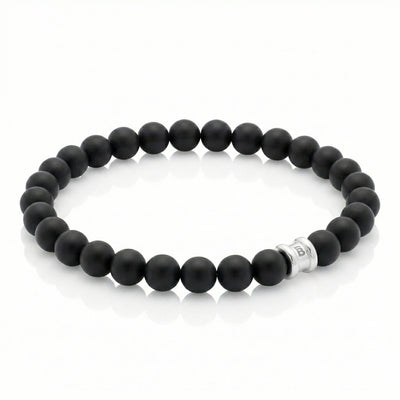 Black onyx men’s bracelet with matte round gemstone beads and stainless steel accent bead on a white background