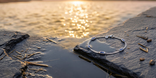 bracelet laying on a stone at sunset