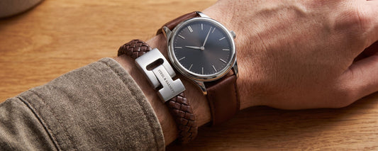bracelet and watch worn on a man's wrist