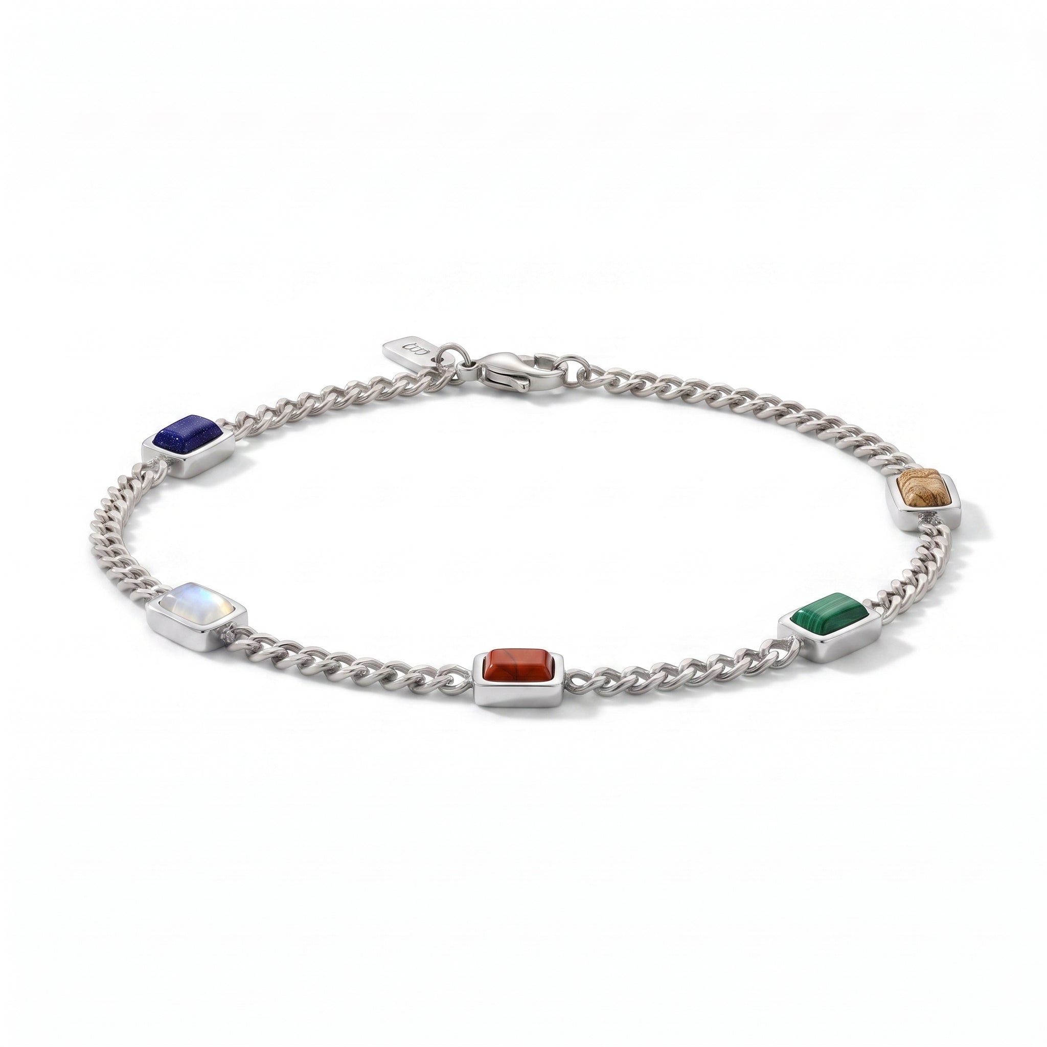 A silver chain bracelet featuring five rectangular gemstone charms in different colors (blue, white, red, green, brown) set in polished silver tiles, displayed on a clean white background.