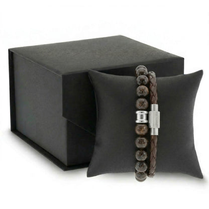 Brown beaded men's bracelet with natural stone beads and braided leather bracelet with stainless steel clasp on a black cushion with gift box