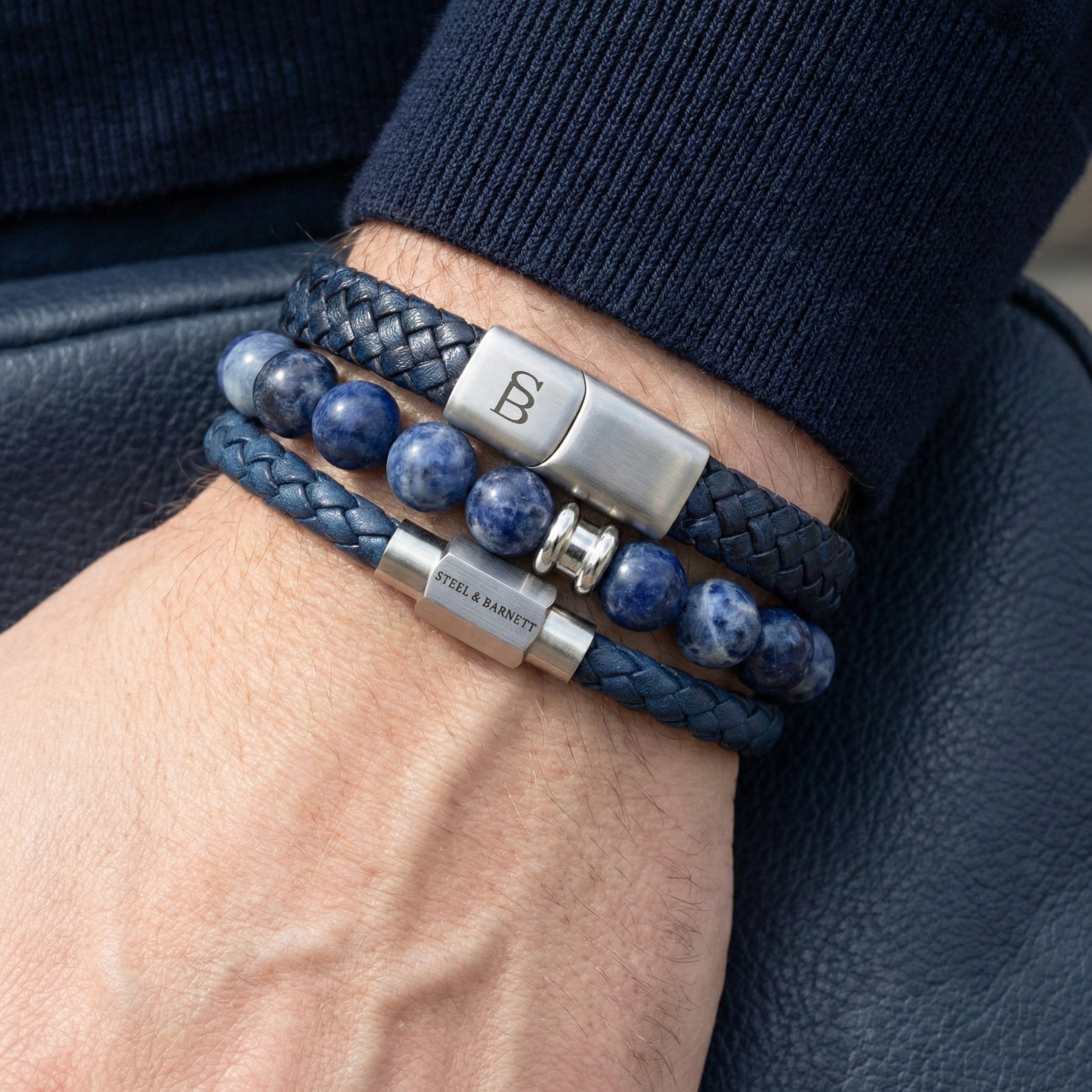 Blue braided leather men’s bracelet stack with natural stone bead bracelet and brushed stainless steel magnetic clasps worn on wrist