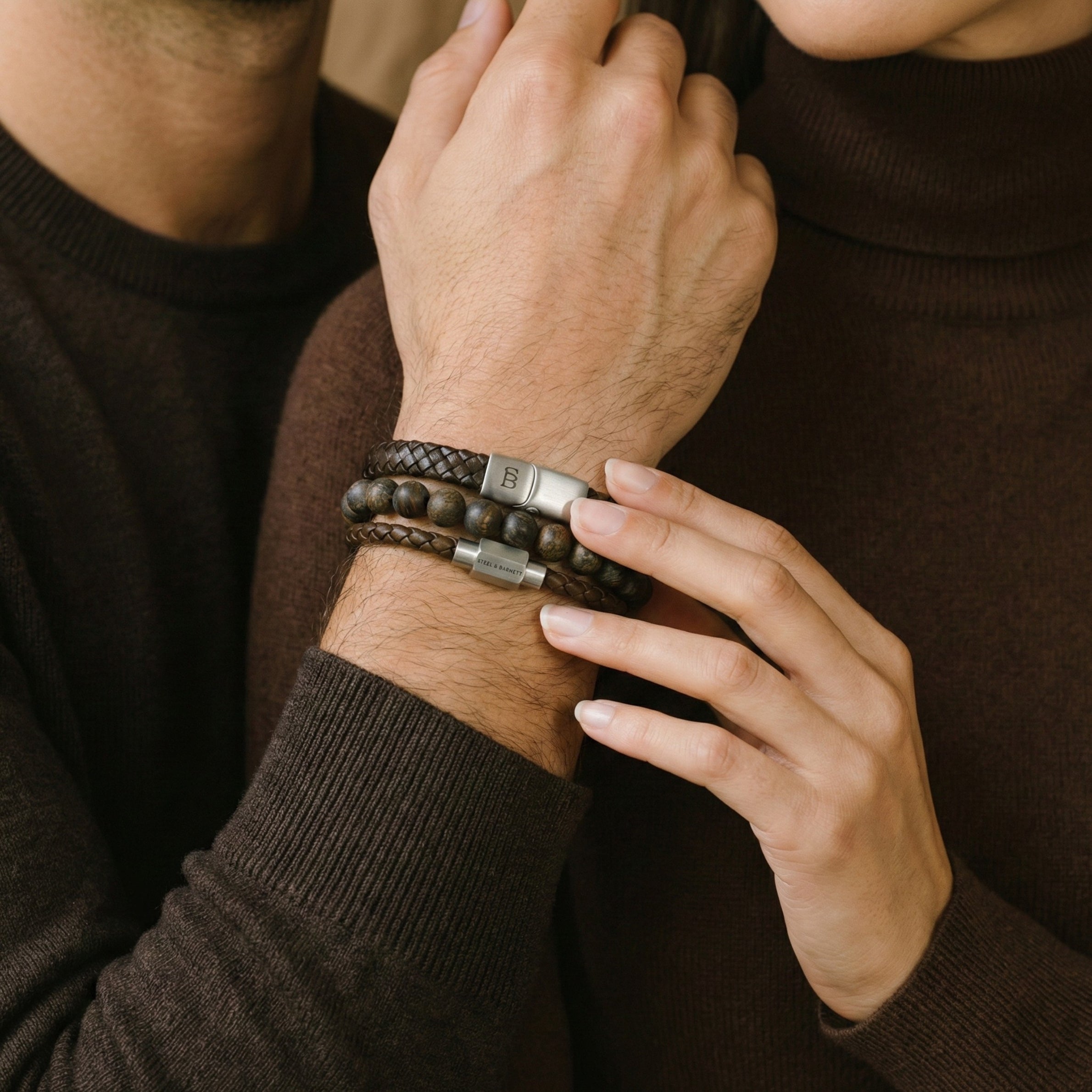 Layered brown leather men’s bracelet set with natural stone bead bracelet and brushed stainless steel clasps worn on wrist