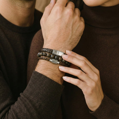 Layered brown leather men’s bracelet set with natural stone bead bracelet and brushed stainless steel clasps worn on wrist