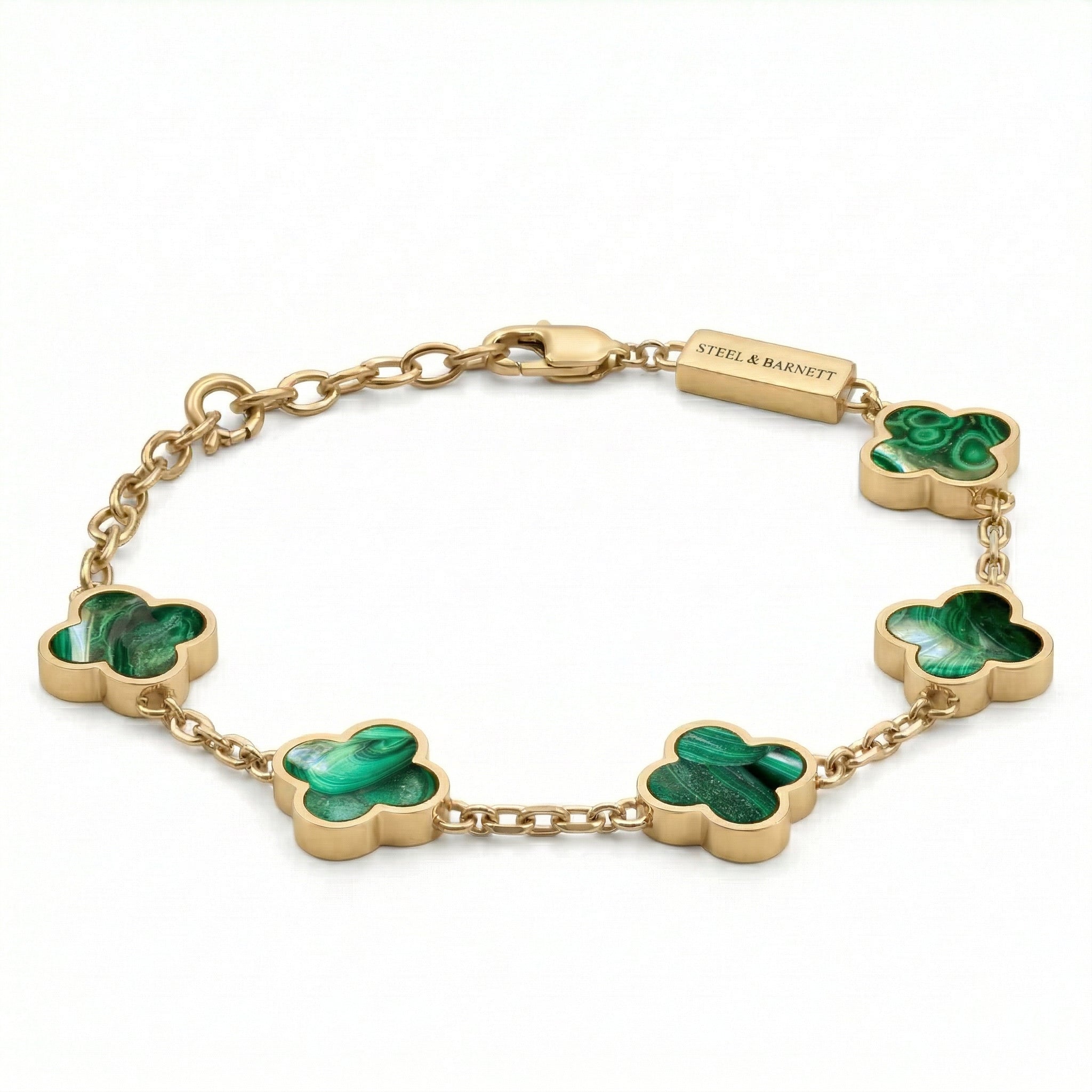 Gold toned men’s bracelet with green clover shaped stone inlays in a chain design and plated 18K gold clasp on a white background
