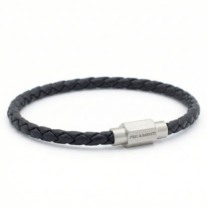 Black braided leather men’s bracelet with brushed stainless steel magnetic clasp on a white background