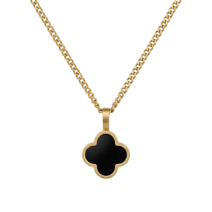 Gold necklace with a black onyx clover pendant on a white background