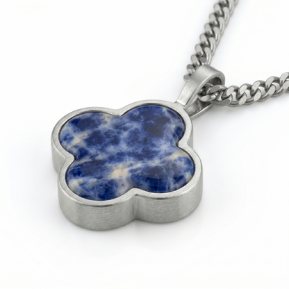Silver pendant with a blue sodalite stone on a white background