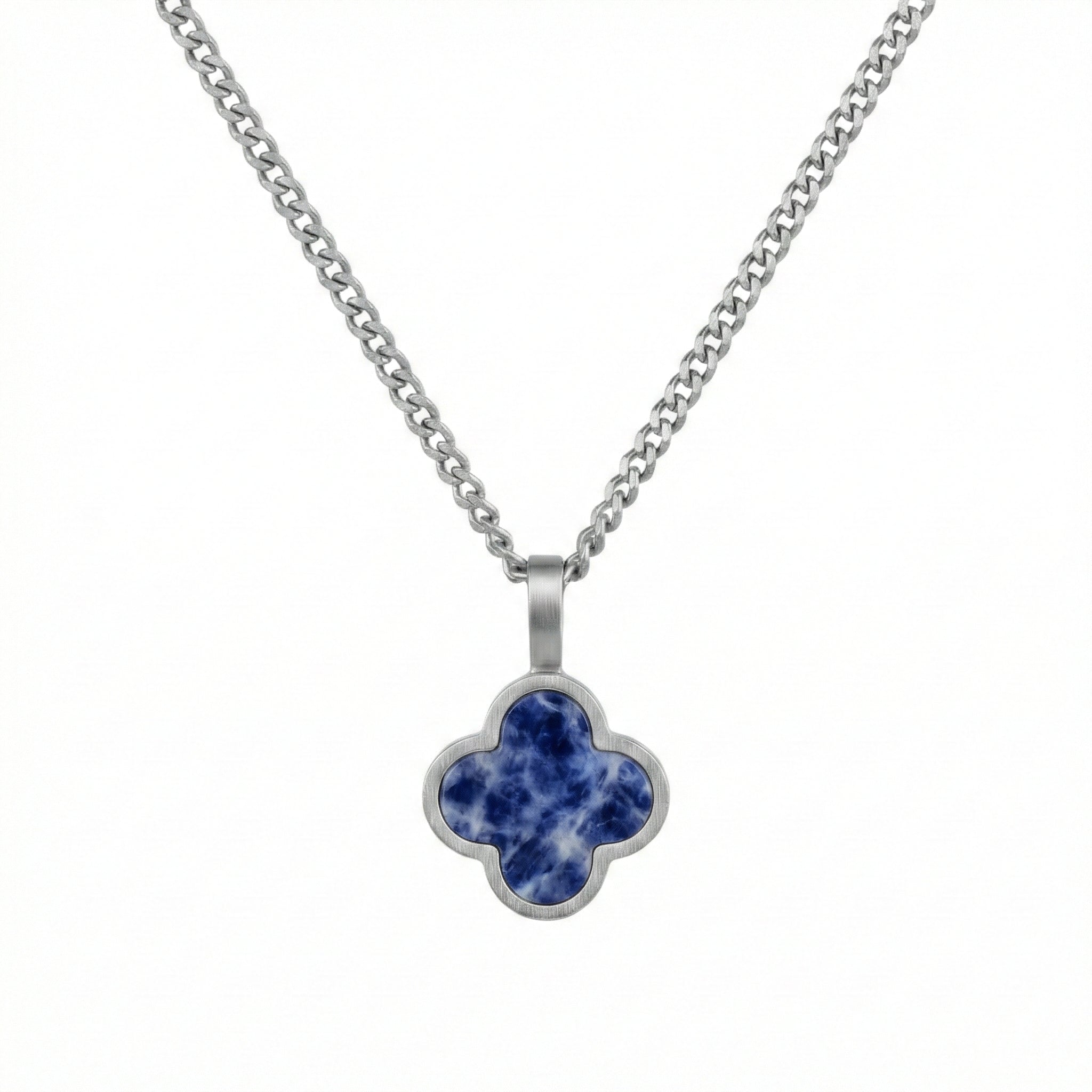 Silver necklace with a blue clover-shaped sodalite pendant on a white background