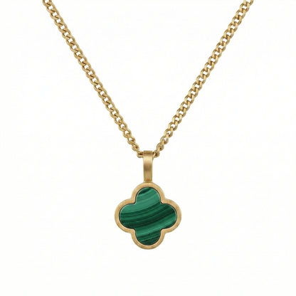 Gold necklace with a green Malachite clover-shaped pendant on a white background