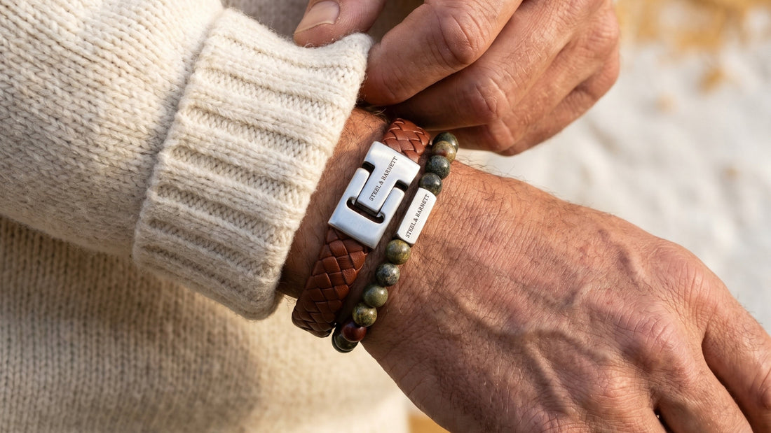 Brown braided leather men's bracelet with stainless steel clasp stacked with Dragon Blood stone beaded bracelet on wrist
