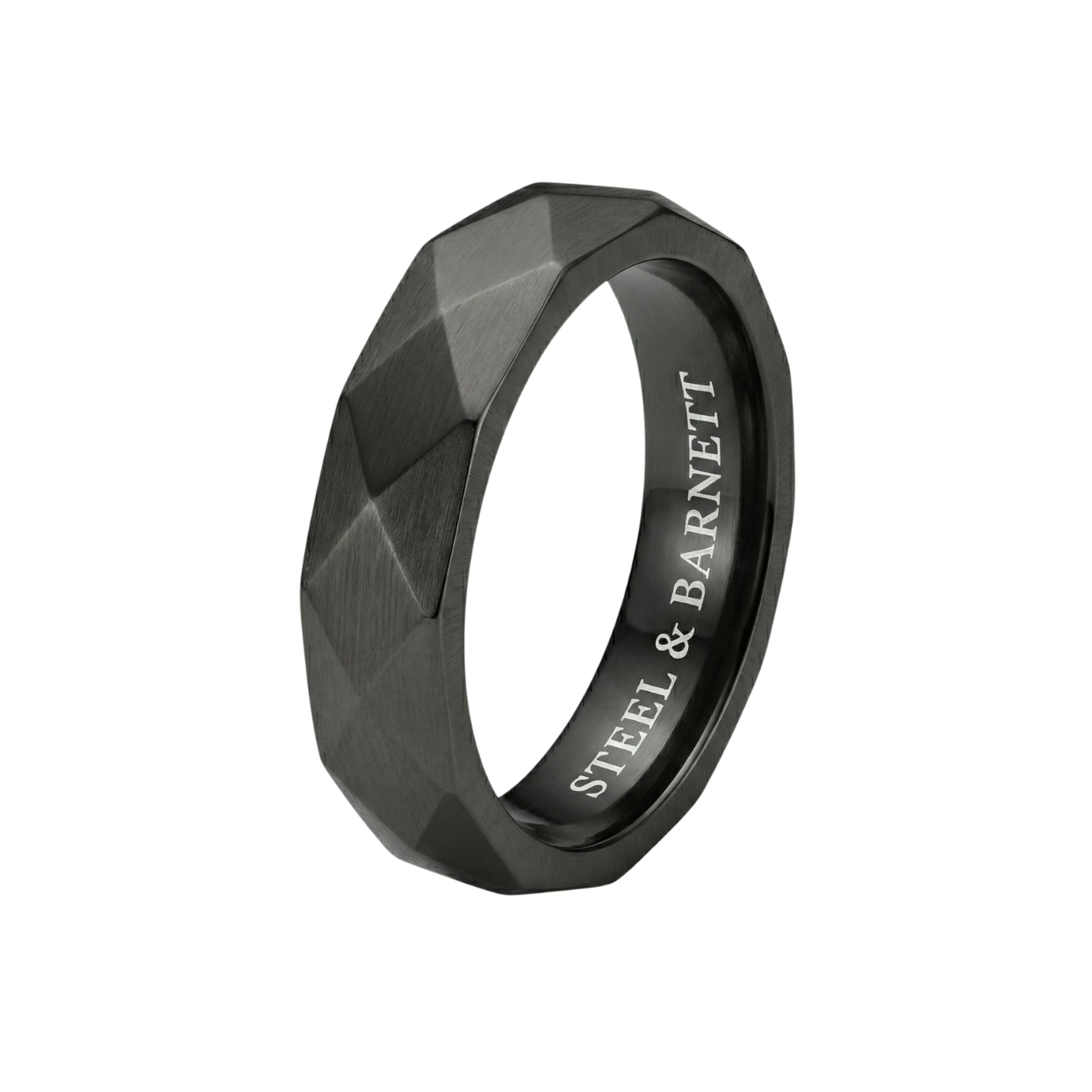 Black stainless steel men's ring with a brushed faceted geometric design isolated on a white background