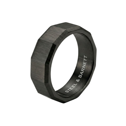 Black stainless steel men's ring with a brushed geometric design isolated on a white background