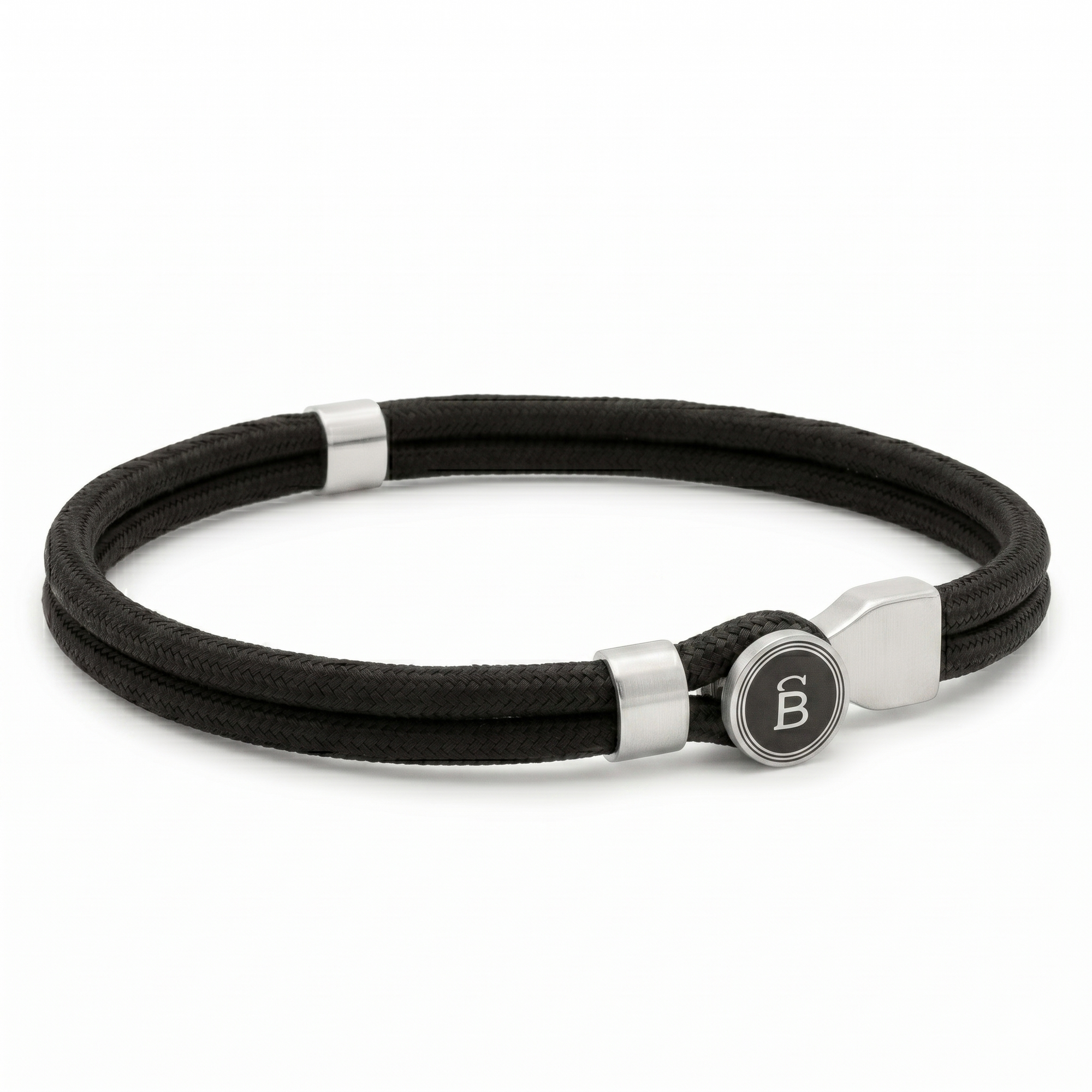 Black rope men’s bracelet with brushed stainless steel magnetic clasp and round logo detail on a white background