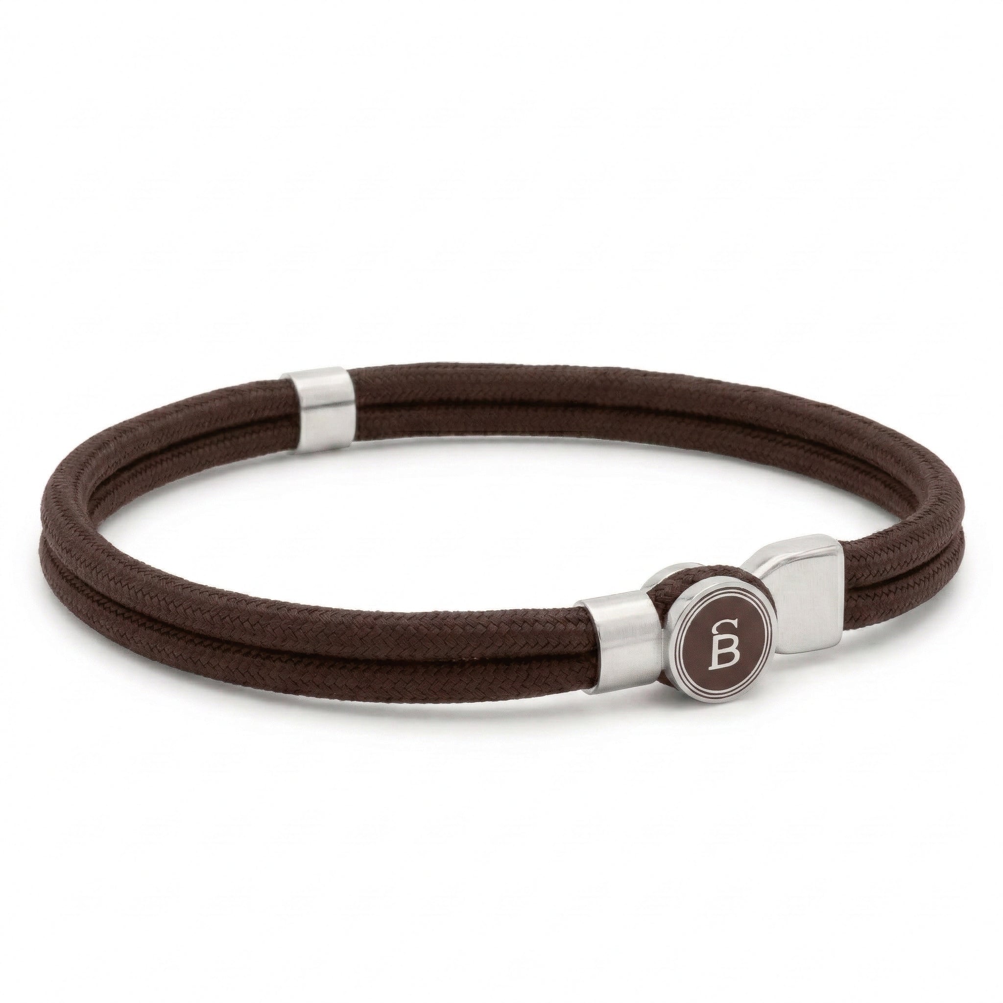 Brown rope men’s bracelet with brushed stainless steel magnetic clasp and round logo detail on a white background