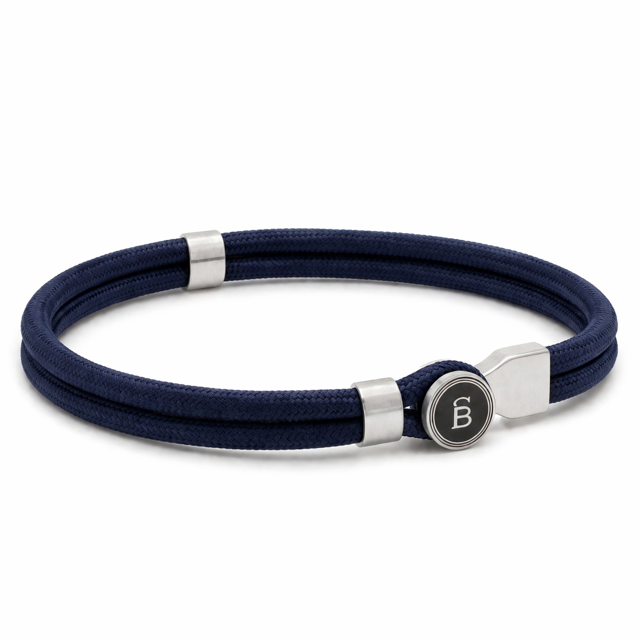 Navy blue rope men’s bracelet with brushed stainless steel magnetic clasp and round logo detail on a white background
