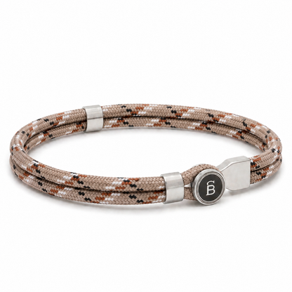 Beige patterned rope men’s bracelet with brushed stainless steel magnetic clasp and round logo detail on a white background