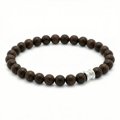 Dark brown wooden bead men’s bracelet with round matte beads and stainless steel accent bead on a white background