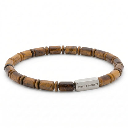 Brown tiger eye men's beaded bracelet with cylindrical natural stone beads and brushed stainless steel accent plate on a white background