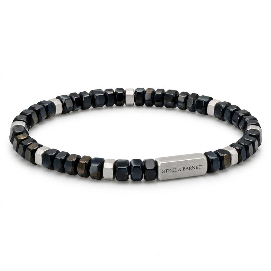 A beaded stretch bracelet featuring faceted dark blue and silver beads, with a polished silver clasp engraved with the brand name 'STEEL & BARNETT'.