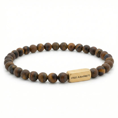 Tiger eye men’s bracelet with matte brown and gold beads and plated 18K gold clasp on white background