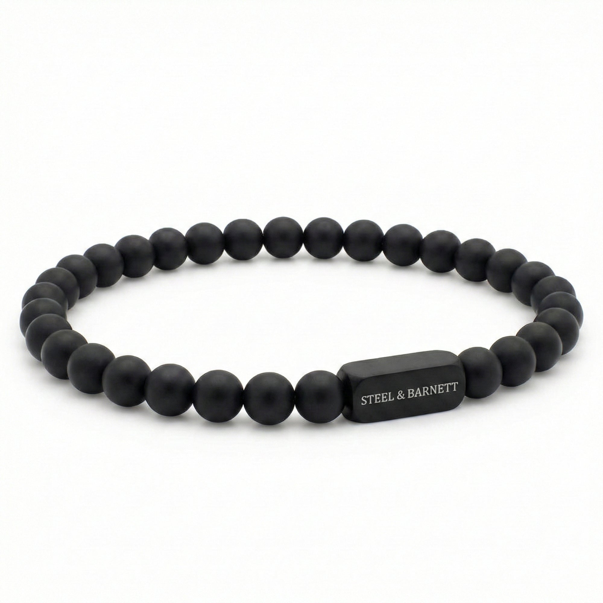 Black onyx men’s bracelet with matte round stone beads and black stainless steel bar on white background
