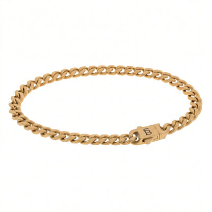 Gold toned stainless steel men’s bracelet with Cuban chain links and plated 18K gold clasp on white background