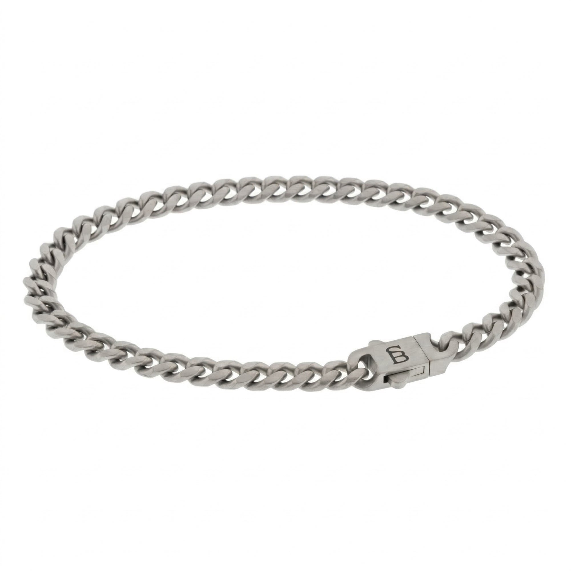 Silver toned stainless steel men’s bracelet with Cuban chain links and engraved clasp on white background