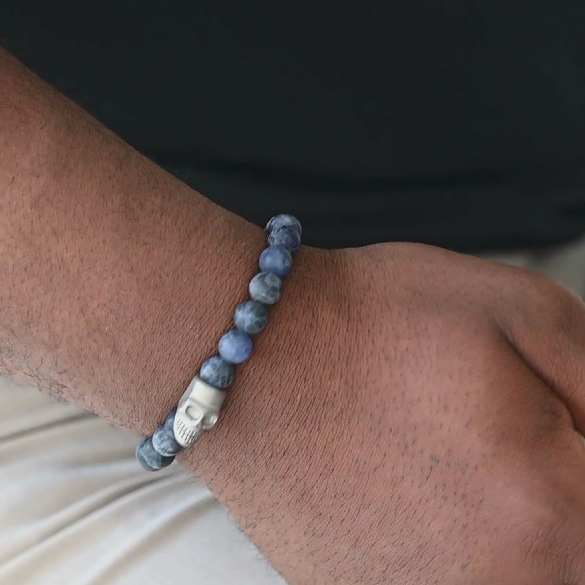 blue and silver stainless steel bracelet by steel and barnett