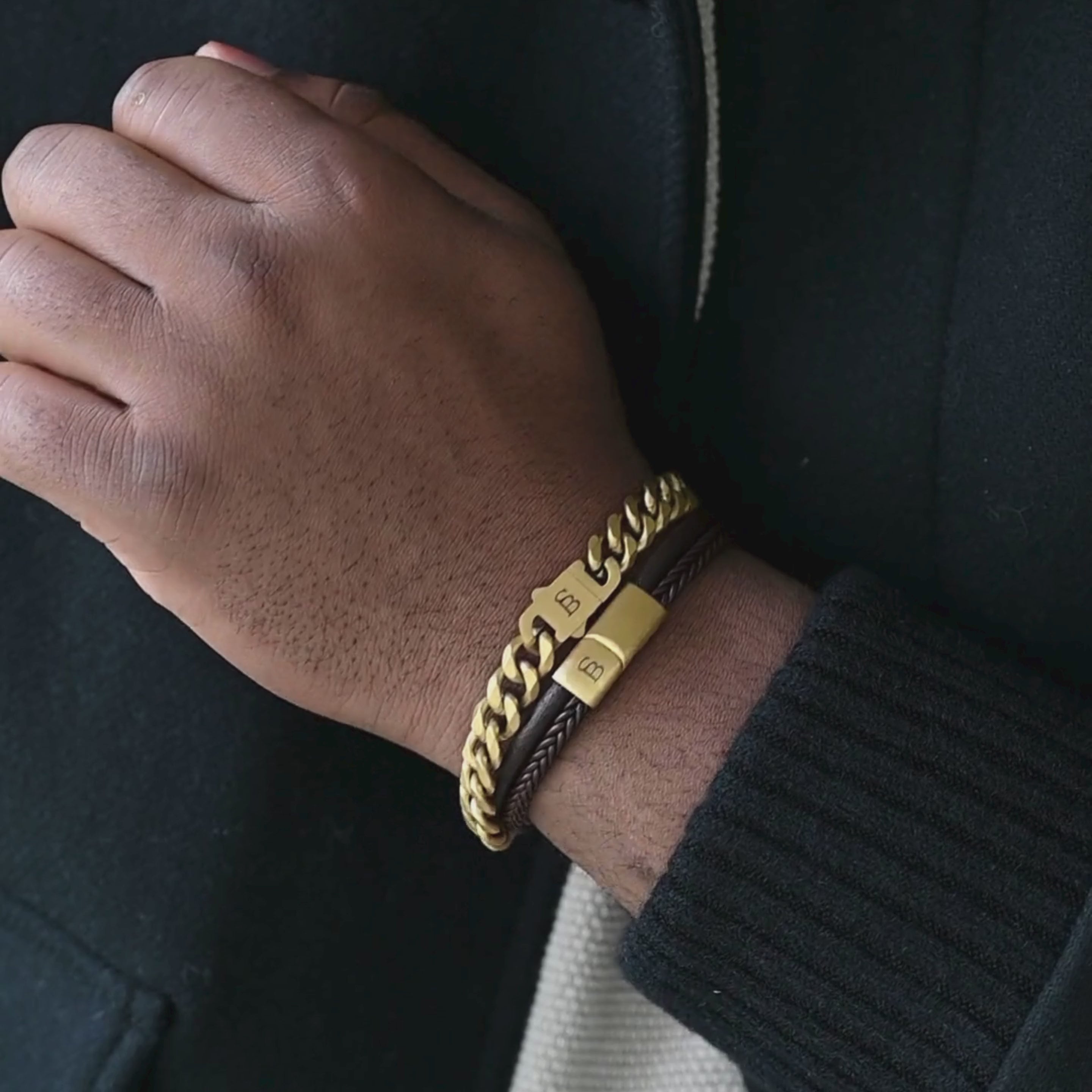 miami style cuban chain bracelet in 18k plated gold stacked with dual leather bracelet