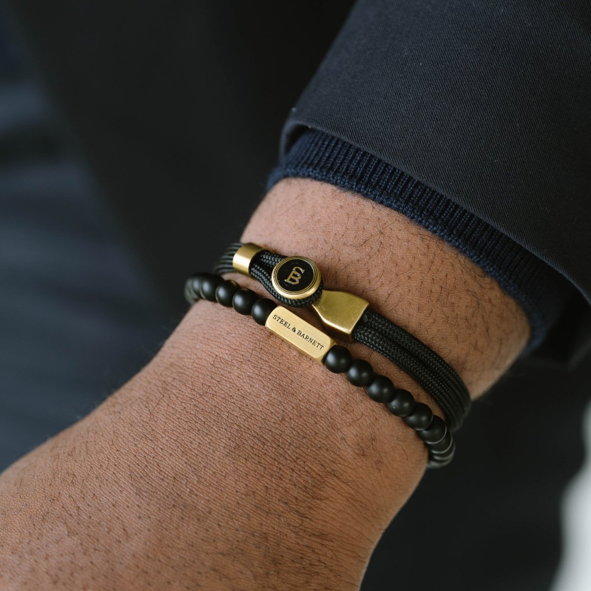 nautical black rope bracelet styled with  matching bead bracelet